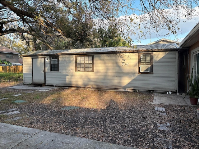 view of side of property featuring fence