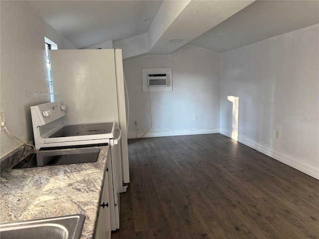 kitchen with dark wood-style flooring, baseboards, an AC wall unit, light countertops, and white range with electric stovetop