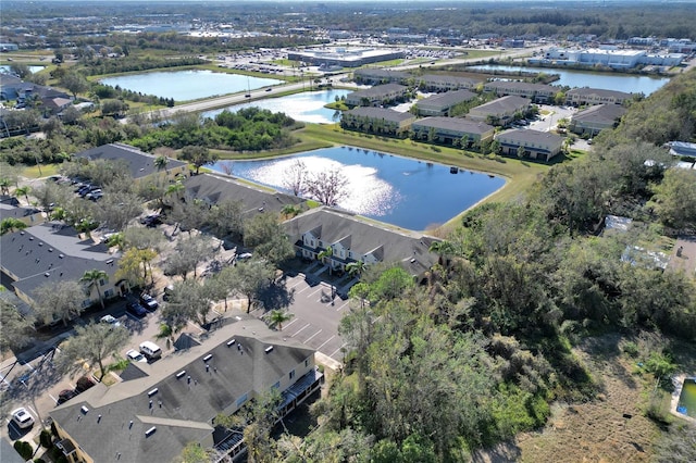 drone / aerial view with a residential view and a water view