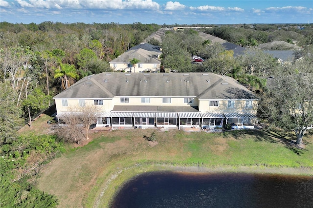 bird's eye view with a water view and a forest view