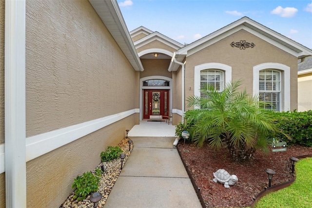 doorway to property with stucco siding