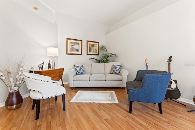 living room with wood finished floors and baseboards