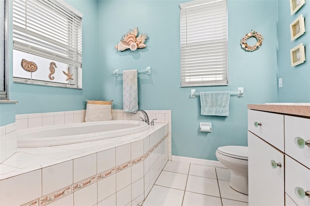 full bathroom with a bath, tile patterned flooring, toilet, and a wealth of natural light