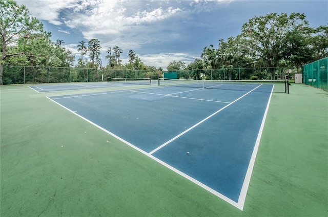 view of sport court with fence