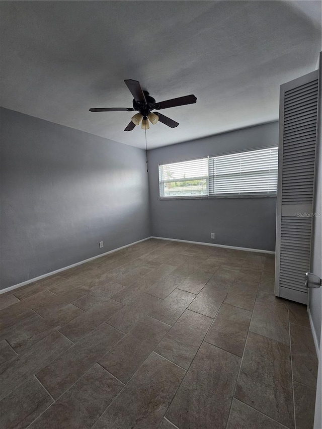 1433 S Belcher Rd Unit A12, Clearwater, FL 33764 - unfurnished room with a ceiling fan and baseboards