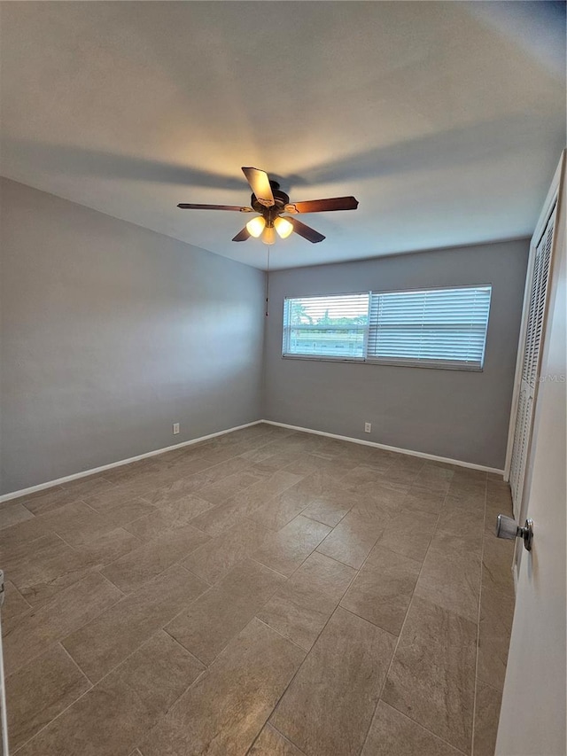1433 S Belcher Rd Unit A12, Clearwater, FL 33764 - unfurnished room featuring a ceiling fan and baseboards