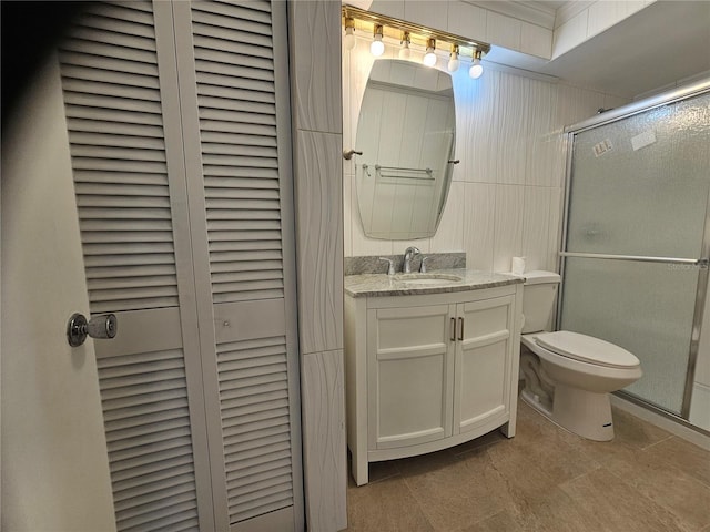 1433 S Belcher Rd Unit A12, Clearwater, FL 33764 - full bathroom with a closet, toilet, vanity, a shower with door, and crown molding
