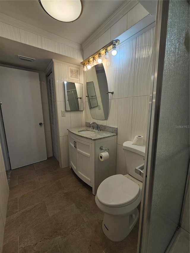 1433 S Belcher Rd Unit A12, Clearwater, FL 33764 - bathroom featuring ornamental molding, vanity, toilet, and a shower