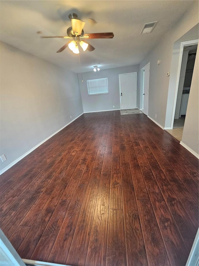 1433 S Belcher Rd Unit A12, Clearwater, FL 33764 - empty room with wood-type flooring, a ceiling fan, and baseboards