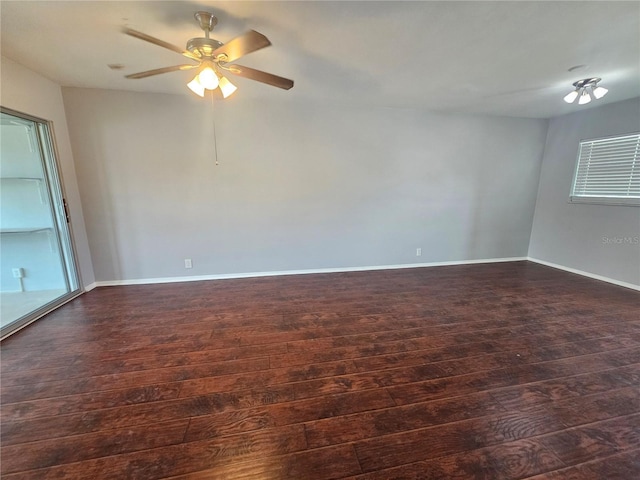 1433 S Belcher Rd Unit A12, Clearwater, FL 33764 - spare room featuring dark wood-style flooring, ceiling fan, and baseboards