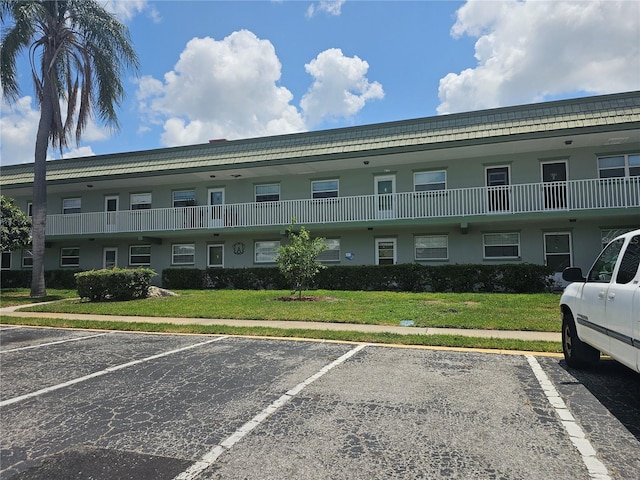 1433 S Belcher Rd Unit A12, Clearwater, FL 33764 - view of building exterior featuring uncovered parking