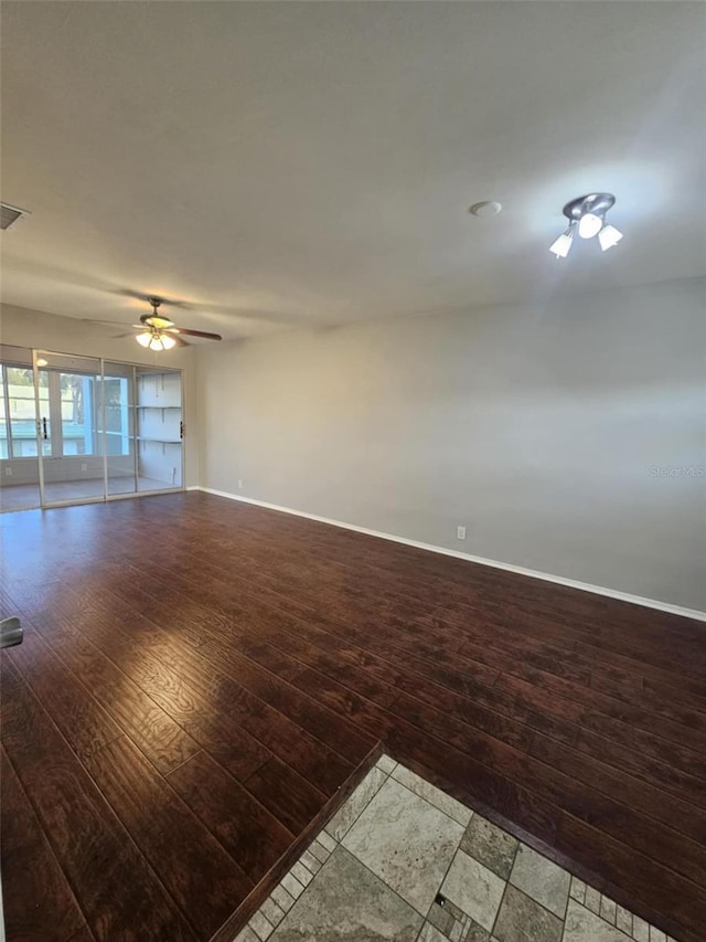 1433 S Belcher Rd Unit A12, Clearwater, FL 33764 - spare room featuring a ceiling fan, baseboards, and wood finished floors