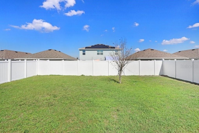 view of yard featuring a fenced backyard