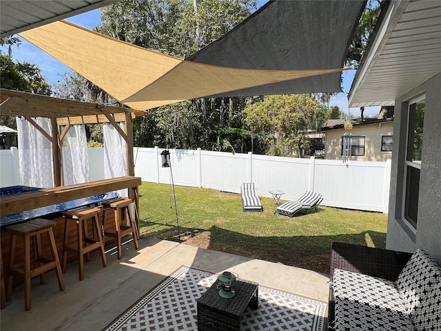 view of patio / terrace with outdoor dry bar and a fenced backyard