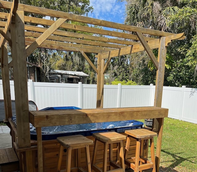 view of patio featuring fence private yard, outdoor dry bar, and a pergola