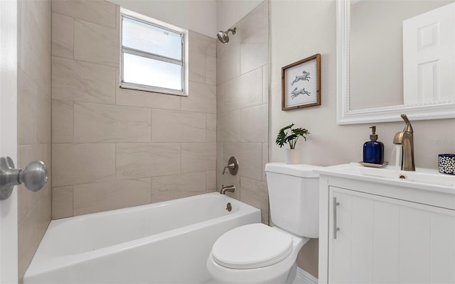 bathroom featuring tub / shower combination, vanity, and toilet