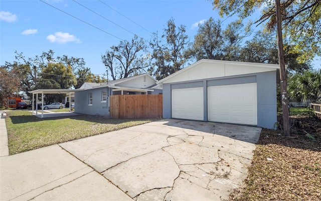 detached garage featuring fence