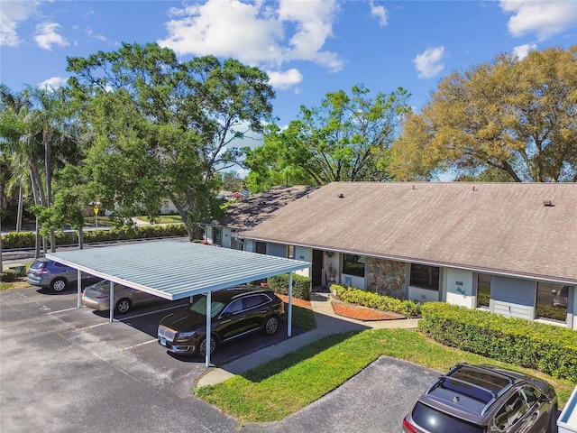 view of property's community with uncovered parking