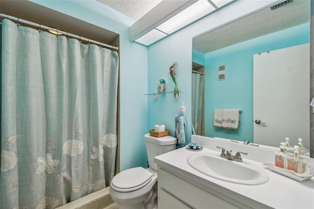 bathroom featuring vanity, a shower with shower curtain, visible vents, a textured ceiling, and toilet