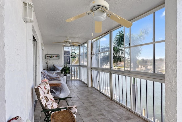 sunroom / solarium with ceiling fan