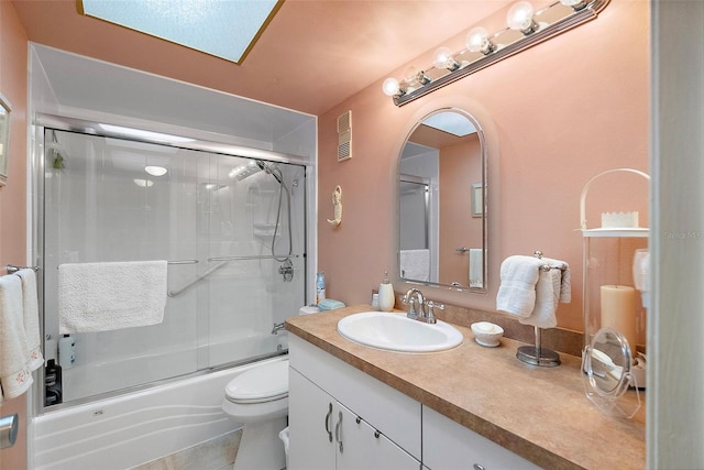 full bathroom with toilet, enclosed tub / shower combo, visible vents, and vanity