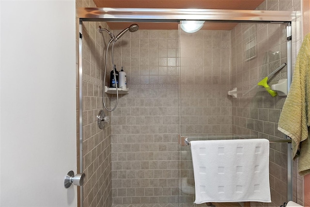 full bathroom featuring a shower stall