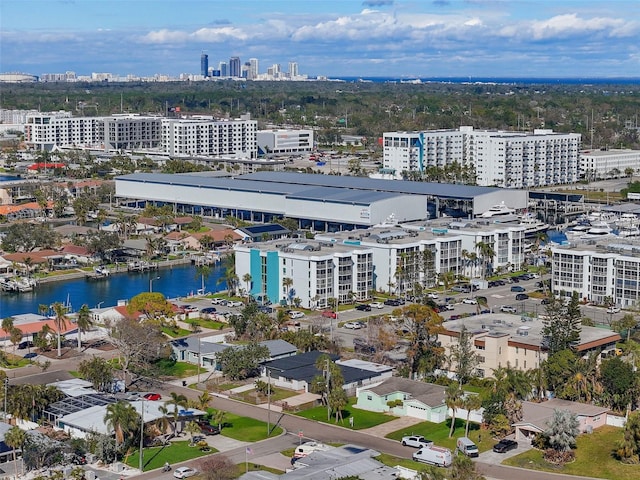 birds eye view of property featuring a water view and a city view