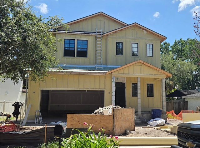 3618 W Royal Palm Cir, Tampa, FL 33629 - view of front of home featuring board and batten siding and a garage