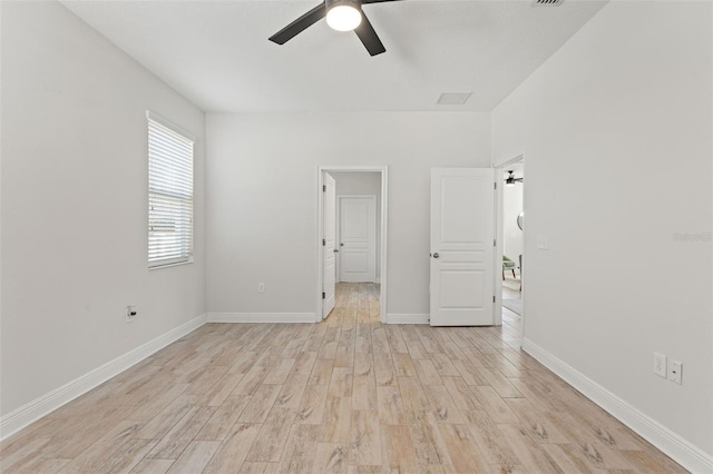 unfurnished bedroom featuring light wood-style flooring, baseboards, and ceiling fan