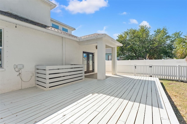 deck featuring fence and french doors