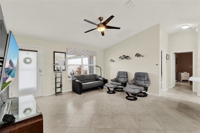 living area with light tile patterned floors, visible vents, baseboards, ceiling fan, and vaulted ceiling