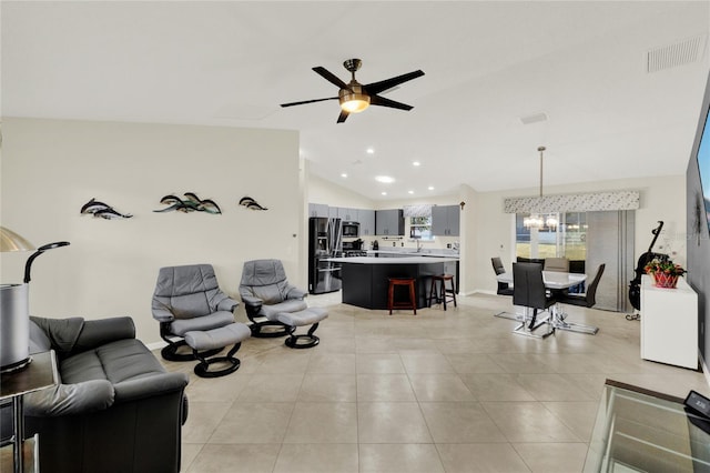 living room featuring light tile patterned floors, visible vents, ceiling fan with notable chandelier, vaulted ceiling, and recessed lighting