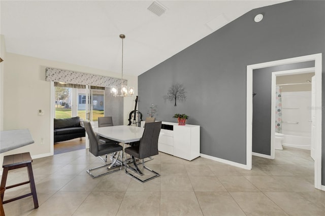 dining room featuring a chandelier, lofted ceiling, light tile patterned flooring, and visible vents