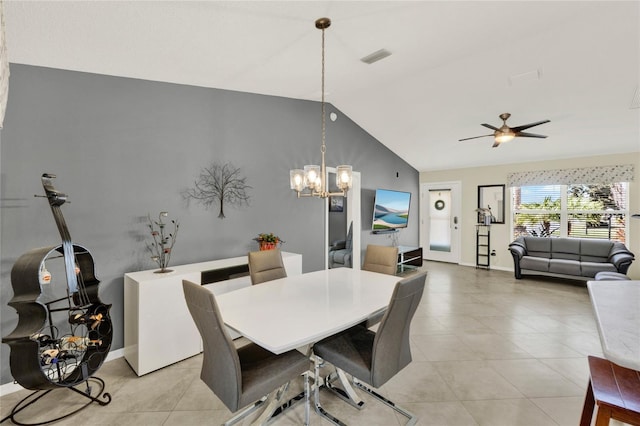 dining area featuring lofted ceiling, light tile patterned floors, visible vents, and baseboards