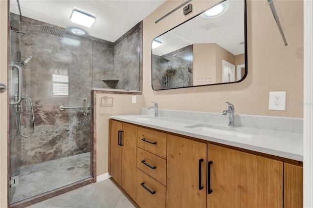 bathroom featuring tile patterned floors, visible vents, a sink, and double vanity