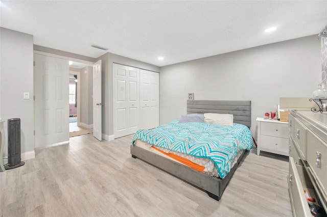 bedroom with recessed lighting, visible vents, baseboards, a closet, and light wood-type flooring