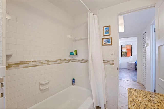 full bathroom with shower / bathtub combination with curtain and tile patterned floors