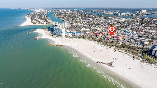 drone / aerial view featuring a view of the beach, a water view, and a view of city