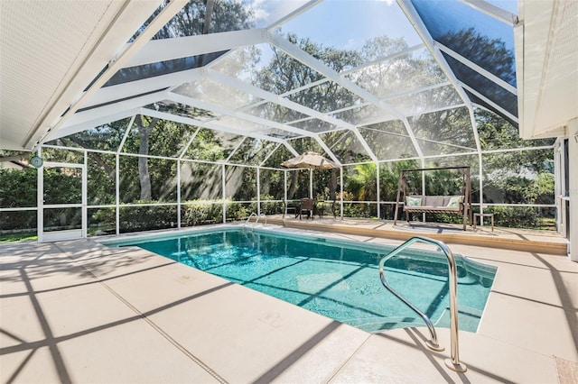 pool featuring a lanai and a patio