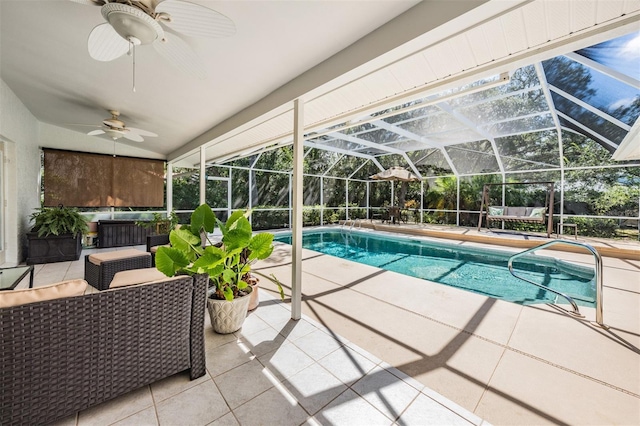 pool with ceiling fan, glass enclosure, a patio, and an outdoor living space