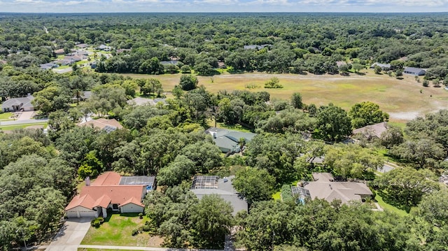 bird's eye view featuring a residential view and a wooded view