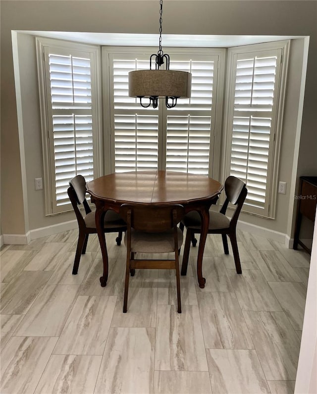 dining space with baseboards