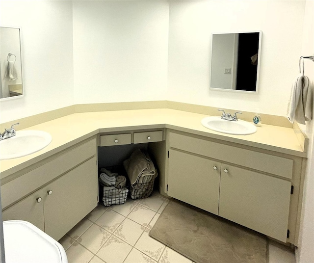 bathroom featuring tile patterned flooring and vanity