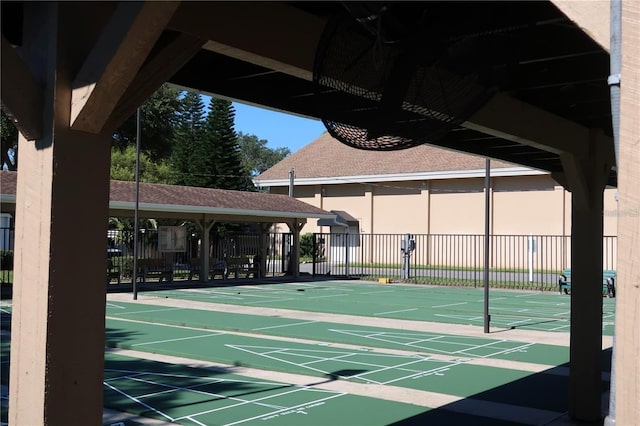 surrounding community featuring shuffleboard and fence