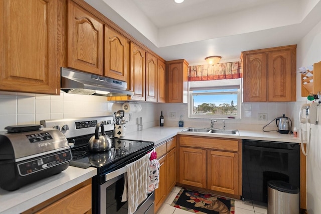 kitchen featuring stainless steel electric stove, brown cabinets, a sink, and under cabinet range hood