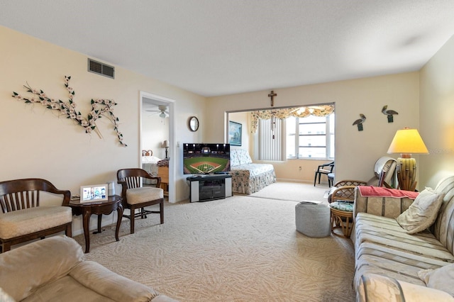 carpeted living room featuring visible vents