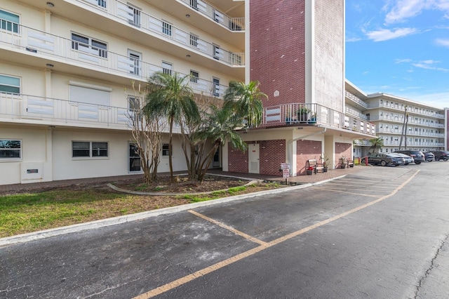 view of property with uncovered parking