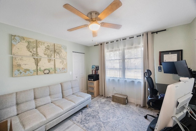 office area with a ceiling fan