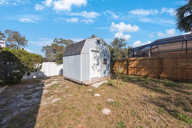 view of shed with a fenced backyard