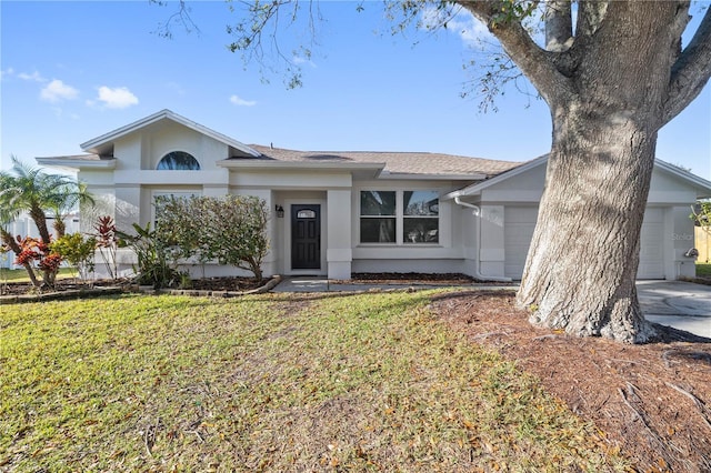 ranch-style house featuring a front yard, driveway, an attached garage, and stucco siding